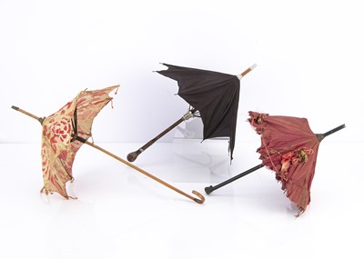 Lot 939 - Three doll’s parasols and umbrellas