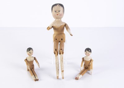 Lot 952 - Three German pegged wooden dolls