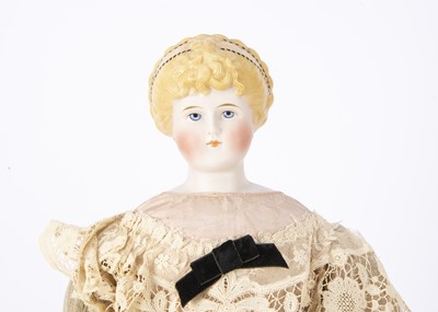 Lot 963 - A rare German bisque shoulder head doll marked 1030