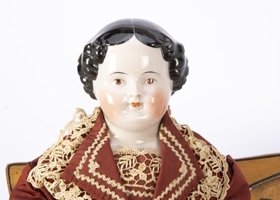 Lot 964 - A 19th German china shoulder head pink tinted doll