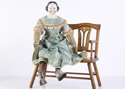 Lot 968 - A 19th century German china shoulder head doll