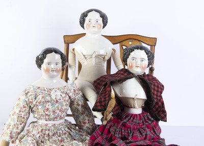 Lot 970 - Three china shoulder-head dolls