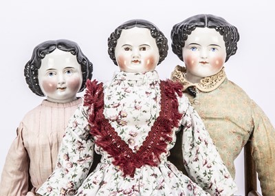 Lot 971 - Three china shoulder-head dolls