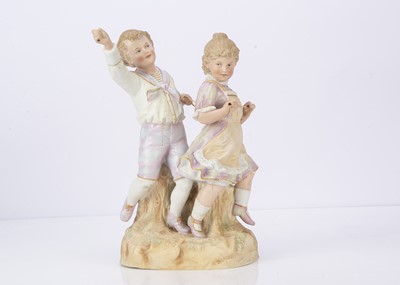 Lot 972 - A rare Gebruder Heubach group of a boy and girl playing horsey-horsey