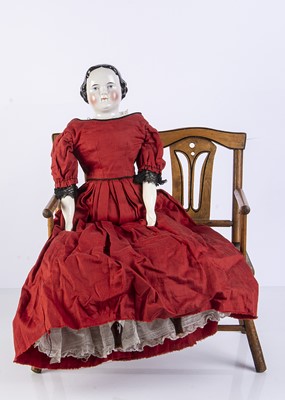 Lot 990 - A 19th century German china shoulder-head doll