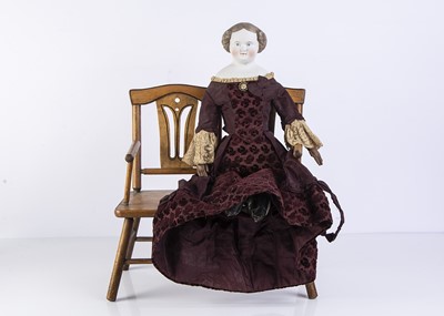 Lot 991 - A 19th century German bisque shoulder-head doll