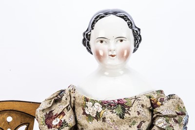 Lot 1015 - A large 19th century German china shoulder-head doll