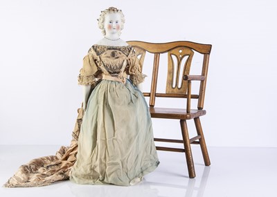 Lot 1017 - A 19th century German bisque shoulder-head doll floral hair garland
