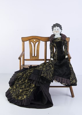 Lot 1018 - An unusual 19th century German china shoulder head doll