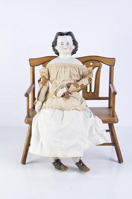 Lot 1020 - A 19th century German china shoulder head doll
