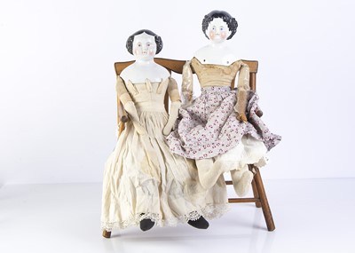 Lot 1022 - Two 19th century German china shoulder head dolls
