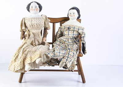 Lot 1023 - Two 19th century German china shoulder head dolls