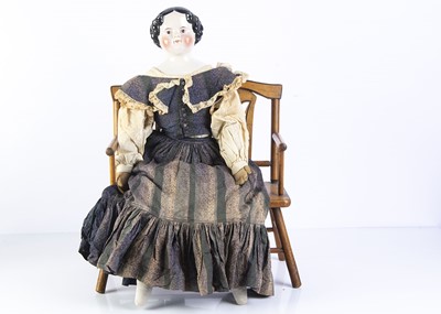 Lot 1025 - A 19th century German pink tinted shoulder head doll