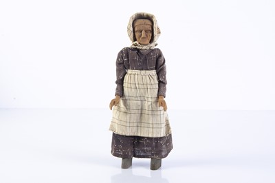 Lot 1073 - An unusual Ozark (USA) carved wooden elderly woman