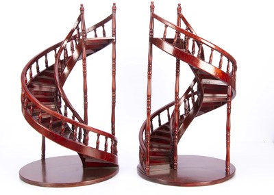 Lot 1090 - A pair of recent wooden spiral staircase doll or shopwindow display stands