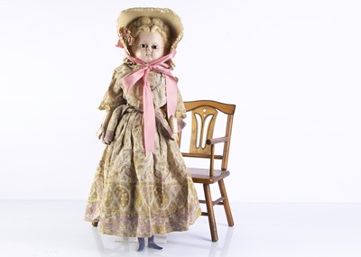 Lot 1095 - A 19th century Pumpkin head wax over composition doll