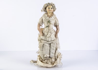 Lot 1096 - A 19th century English wax over papier mache doll