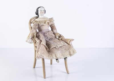 Lot 1097 - A 19th century German china shoulder-head doll