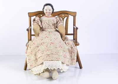 Lot 1122 - A 19th century pink tinted china shoulder head doll