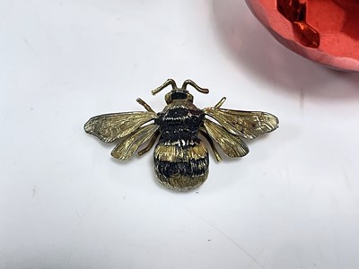 Lot 9 - A modern silver gilt and enamelled honey bee brooch by AIO