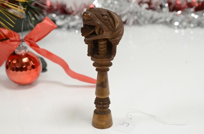 Lot 39 - A late 19th or early 20th century Black Forest wooden nut cracker