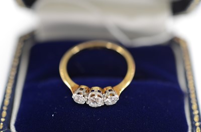 Lot 42 - An 18ct gold and platinum set three stone old cut diamond ring