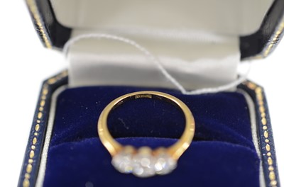 Lot 42 - An 18ct gold and platinum set three stone old cut diamond ring