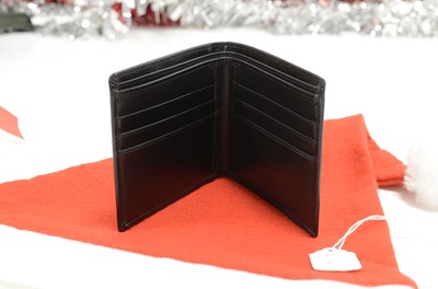 Lot 73 - A modern Maurice Lacroix black leather wallet