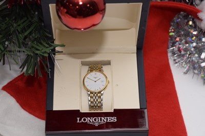 Lot 115 - A modern Longines quartz stainless steel and gilt wristwatch