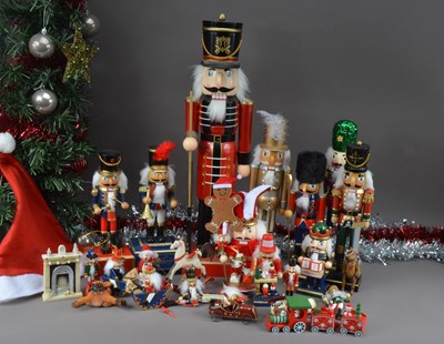 Lot 155 - A large collection of modern nut cracker figures and other Christmas decorations