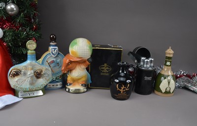 Lot 162 - A boxed bottle of QE2 Highland Malt Scoth Whisky in ceramic decanter and four ceramic empty novelty decanters