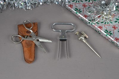 Lot 169 - A Farrow and Jackson Champagne tap and a pair of cork tongs and a pair of Universal sewing scissors in case (4)