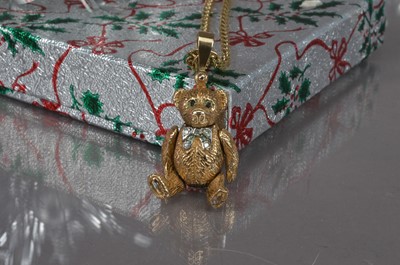 Lot 179 - A cute modern 9ct gold and gem set Teddy Bear pendant on chain