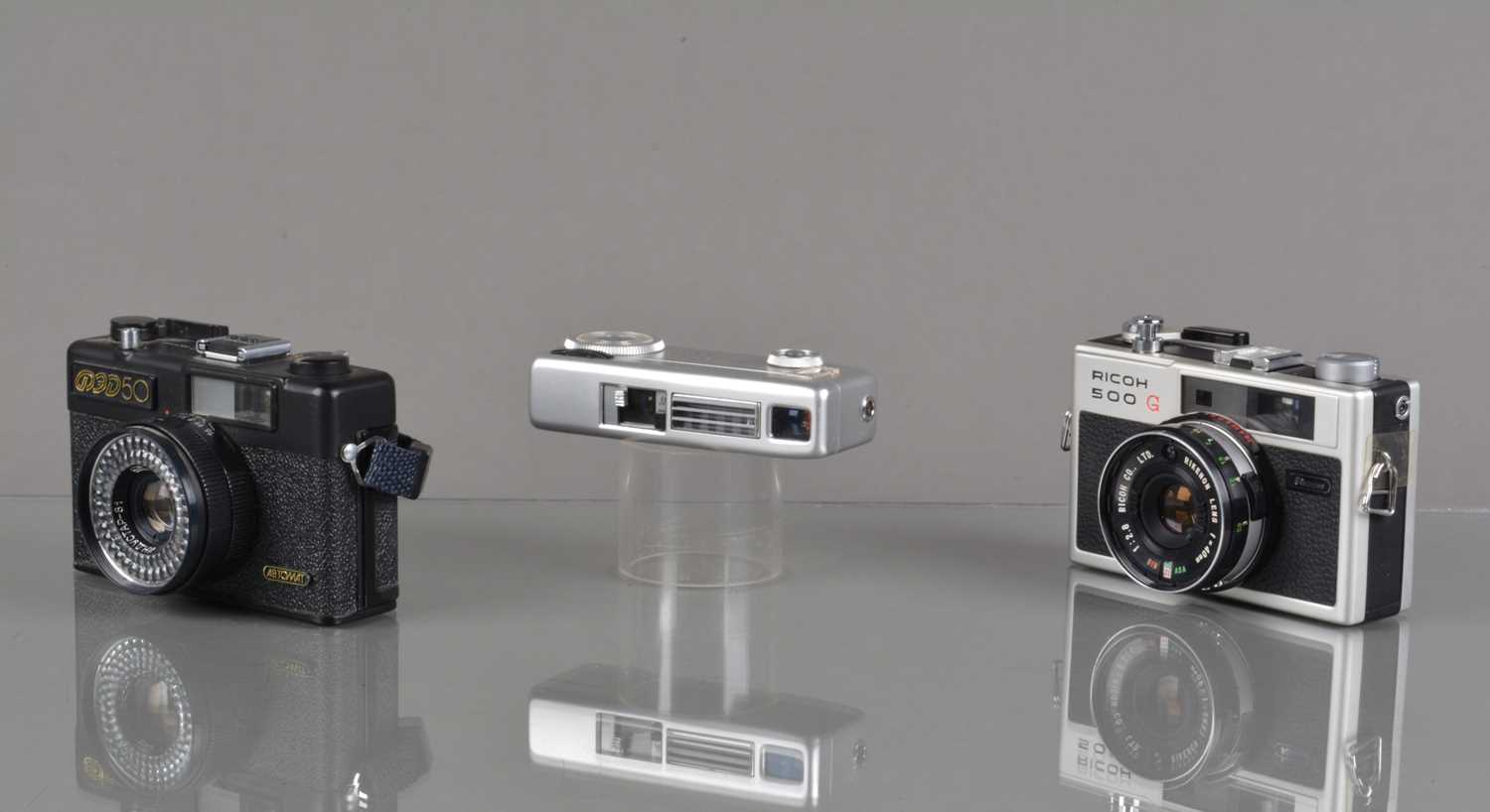 Lot 52 - Three Compact Cameras,
