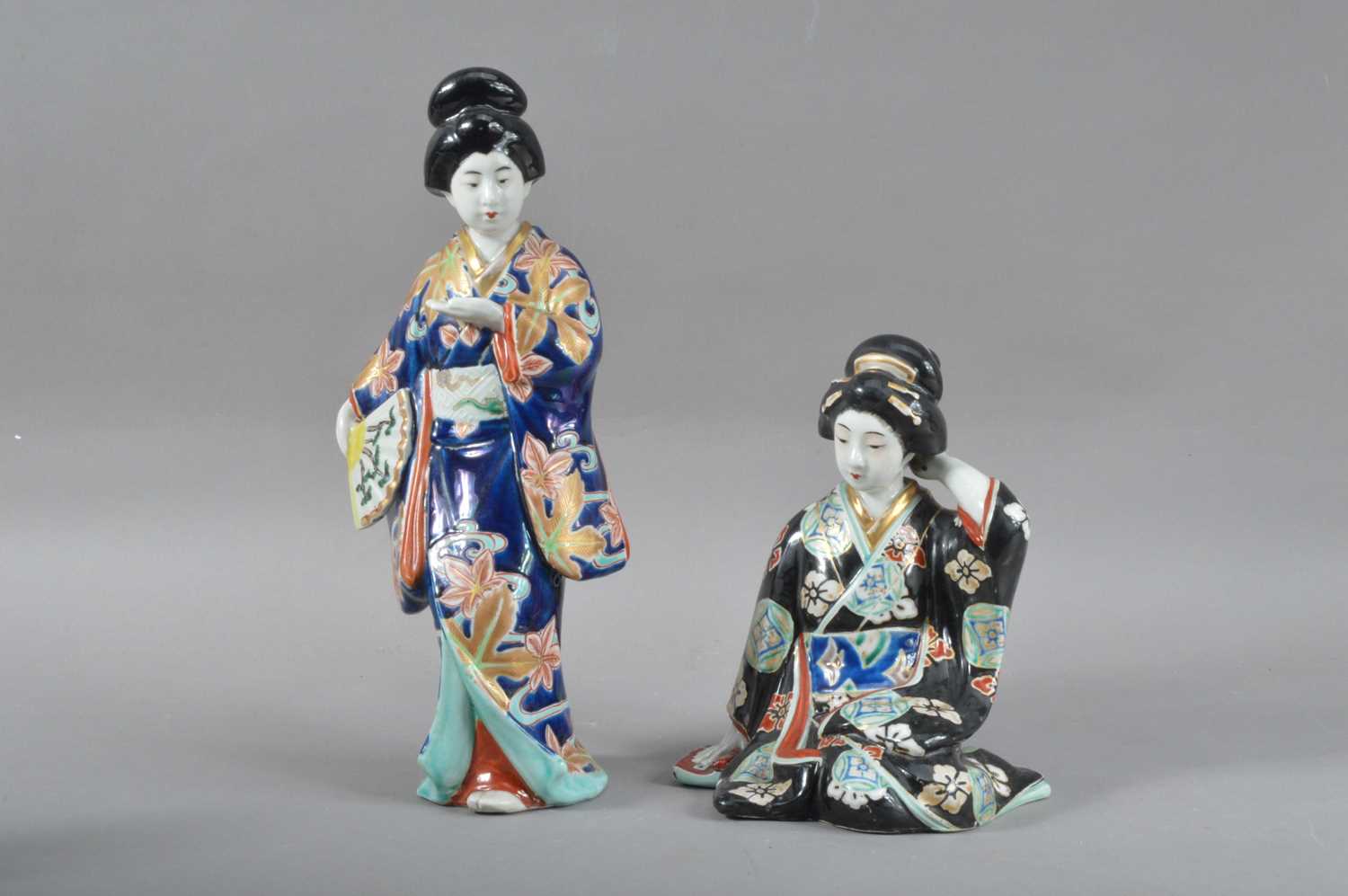 Lot 101 - Two early 20th century Japanese Kutani Geisha lady porcelain figurines
