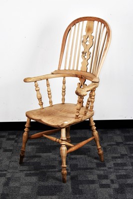 Lot 125 - A 19th century bleached mixed wood Windsor armchair