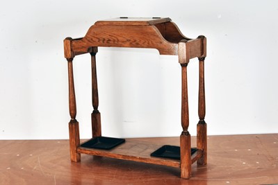 Lot 126 - An early to mid 20th century oak stick stand