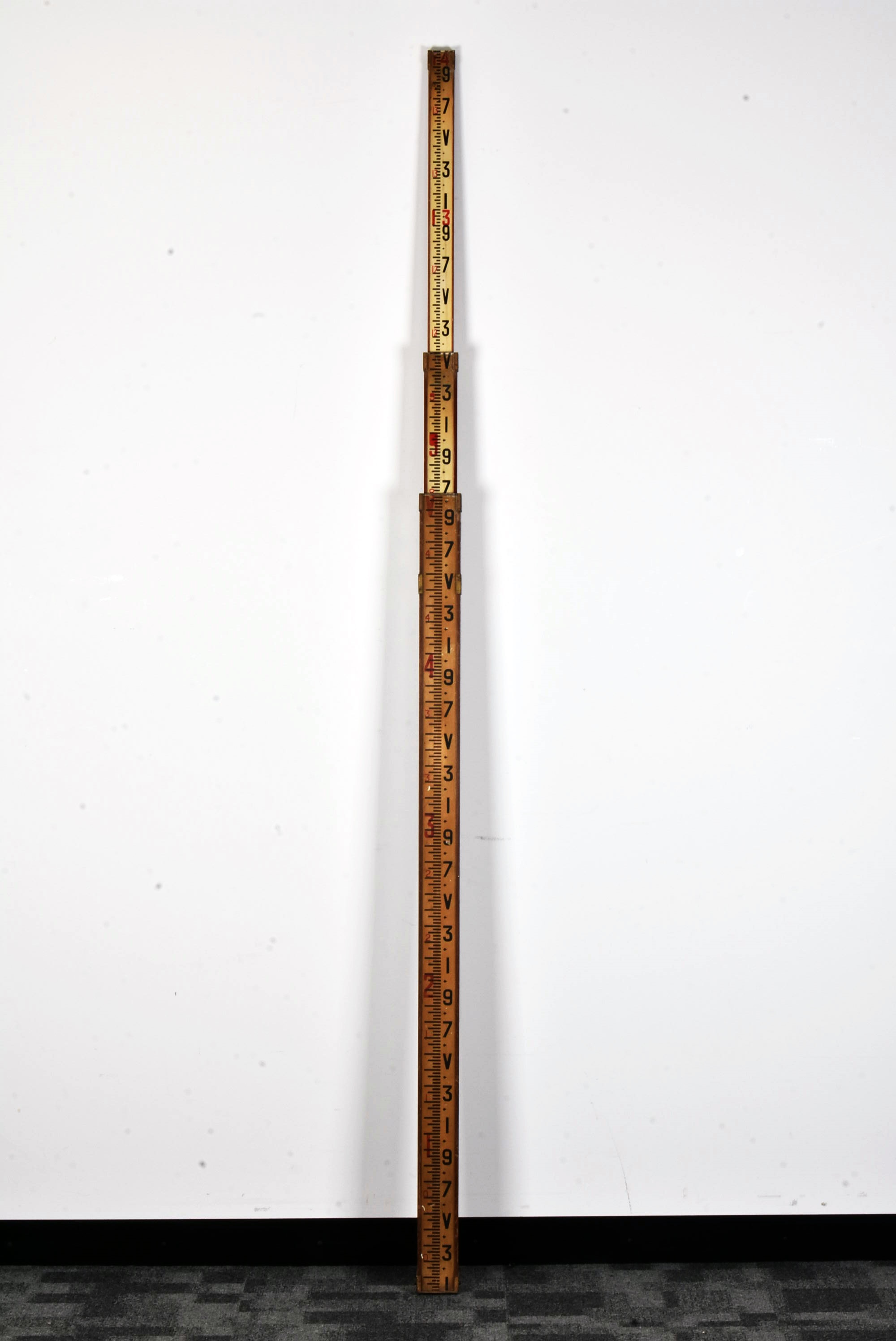 Lot 130 - An extendable measuring stick,