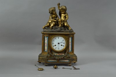 Lot 149 - A French porcelain and brass mantle clock