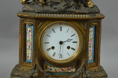 Lot 149 - A French porcelain and brass mantle clock