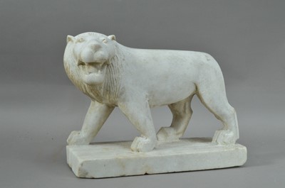 Lot 151 - A crudely carved alabaster lion