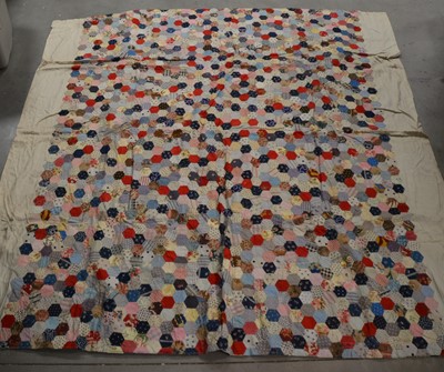 Lot 251 - A large antique patchwork quilt
