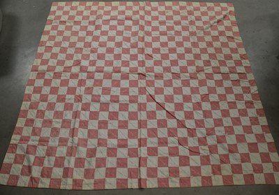 Lot 252 - An antique patchwork quilt
