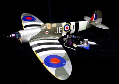 Lot 670 - A Radio Controlled kit built Spitfire and two spare combustion aero engines (3)