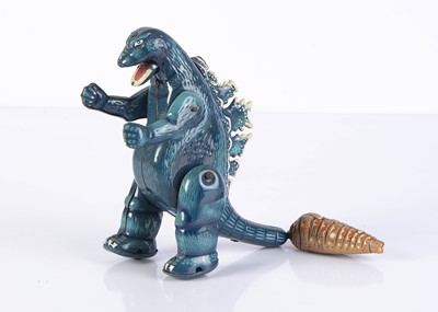 Lot 703 - A Biliken Tinplate Pull String Godzilla Against Mothra Toy