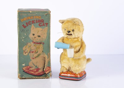 Lot 714 - A Nomura (Japan) Battery-Operated Drinking Licking Cat