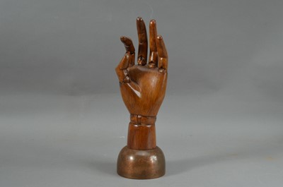 Lot 225 - A wooden articulated hand