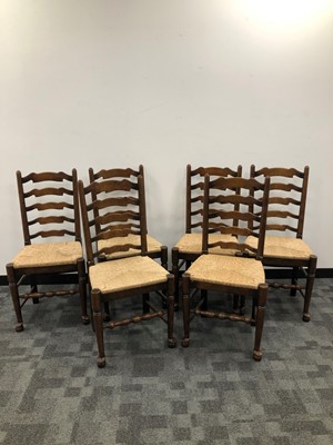 Lot 23 - A set of six early 20th century ladder back chairs
