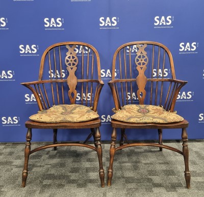 Lot 108 - A pair of 19th century beech kitchen wheelback armchairs