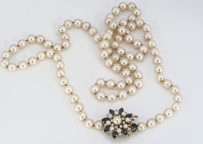 Lot 203 - An opera length uniform cultured knotted pearl necklace